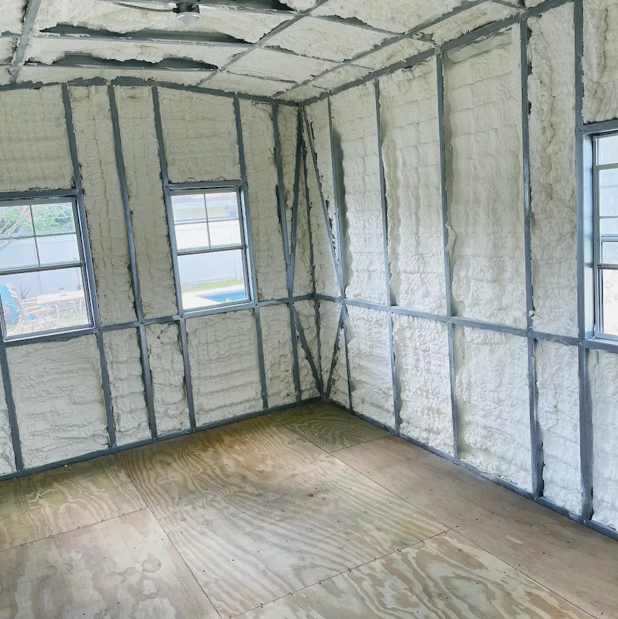 Closed-cell spray foam insulation applied to wall cavities in a residential project in Antis